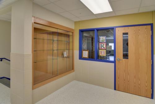An empty trophy case outside the school office