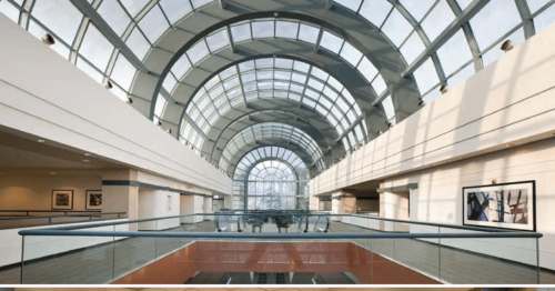 The second floor of the school with an arched glass ceiling