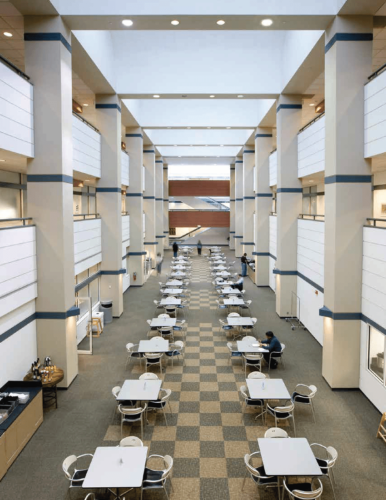 Looking down at a first floor common area with checkered carpeting