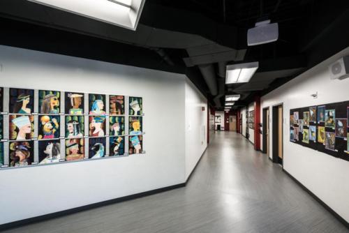 charter school hallway with student art projects hanging on the walls