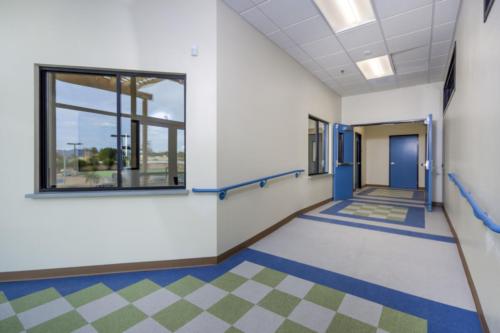 hallway with a set of double doors wide open