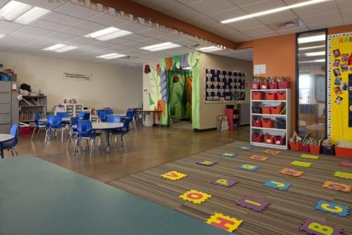 classroom with letters of the alphabet tiled on the floor