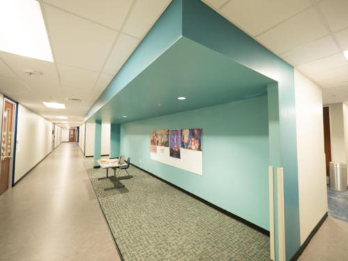 Looking down school hallway and seating area
