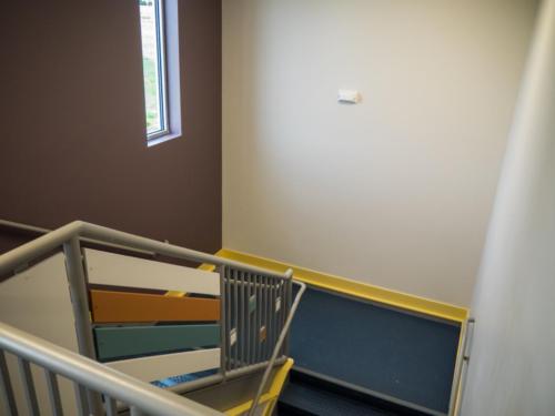 View down a colorful stairwell