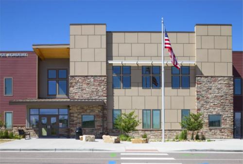 exterior view of the school entrance and flagpole
