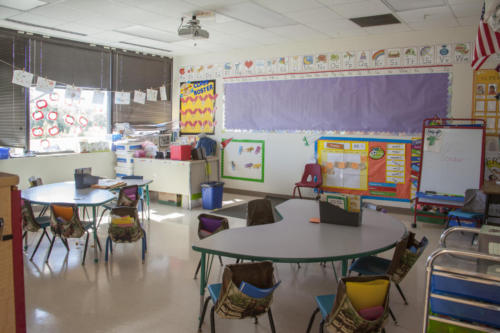Small classroom with horseshoe-shaped tables