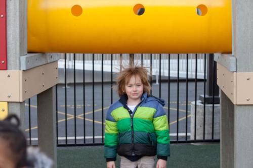 A student with crazy hair on the playground