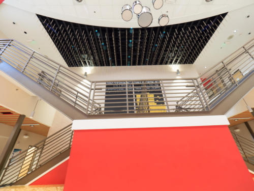 Low angle view of main staircase and unique, artistic ceiling decorations