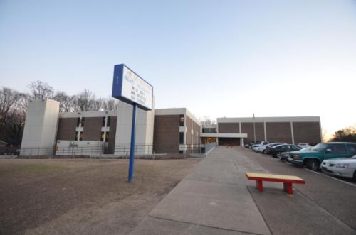 View of the school exterior and display sign